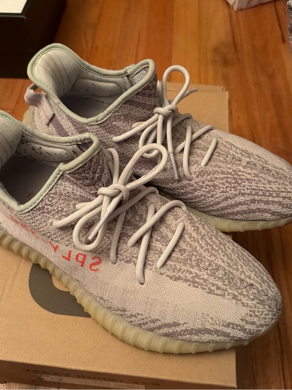 Adidas Yeezy Light Gray Knit Sneakers with Orange Accent